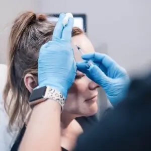 Client receiving a botox treatment in the forehead