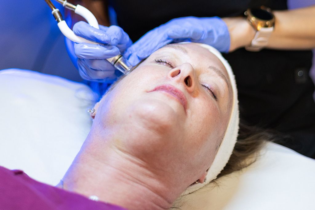 A woman receiving the Diamond Glow Facial at Elite in Spring, TX